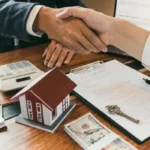 They shook hands after signing the agreement