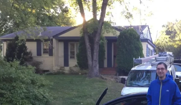 Josh Cohen standing in front of a purchased home in Alexandria, VA