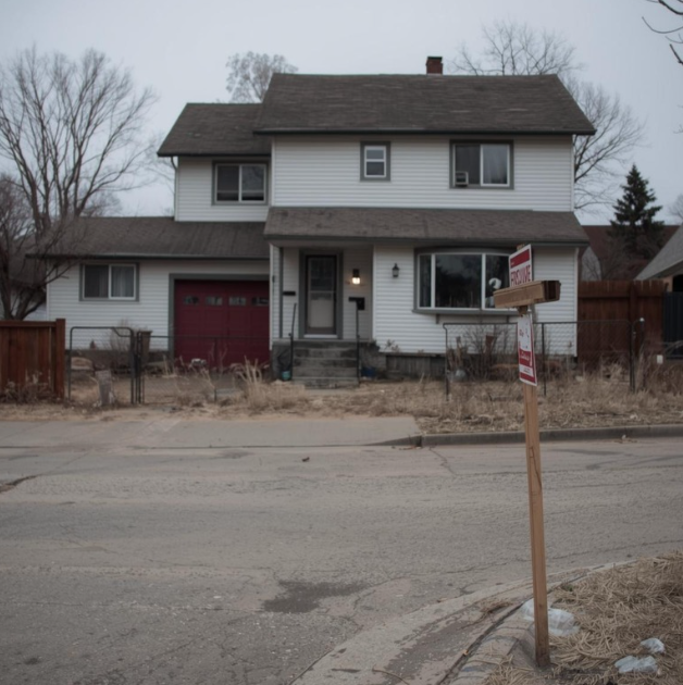 House in Edmonton with a foreclosure sign in front of it