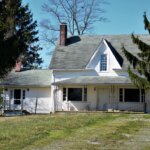 Old-abandoned-white-farmhouse