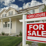 Foreclosure Home For Sale Sign in Front of New House