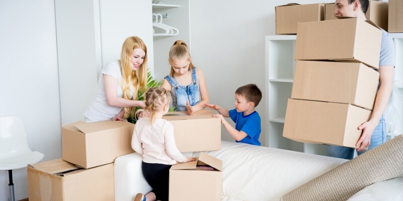 A family packing boxes for a move