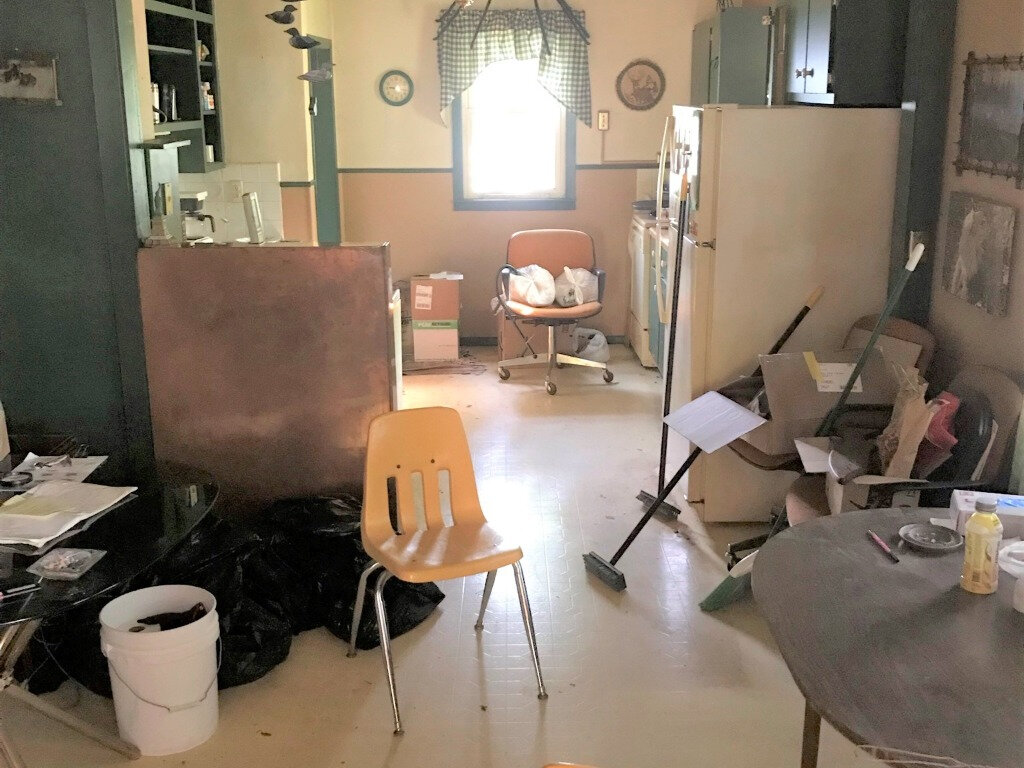 A messy living room in a Bloomington home we bought
