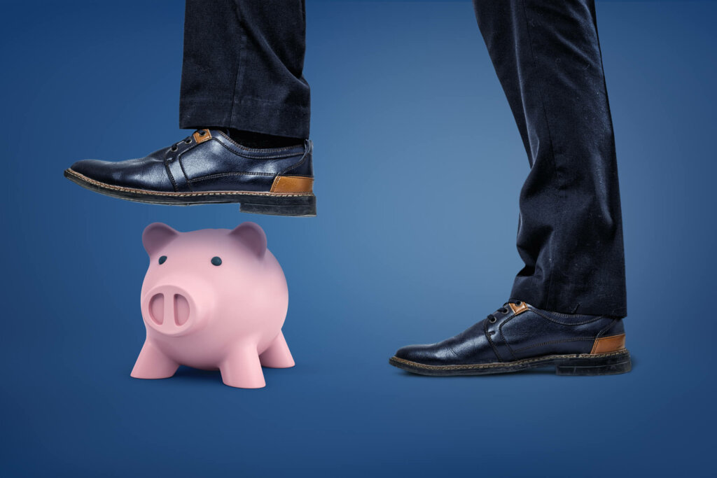 Don't break the bank! Learn how selling your home for cash to Homes to Harmony will actually save you money Homeowner breaks a piggy bank to pay the people involved for selling their house