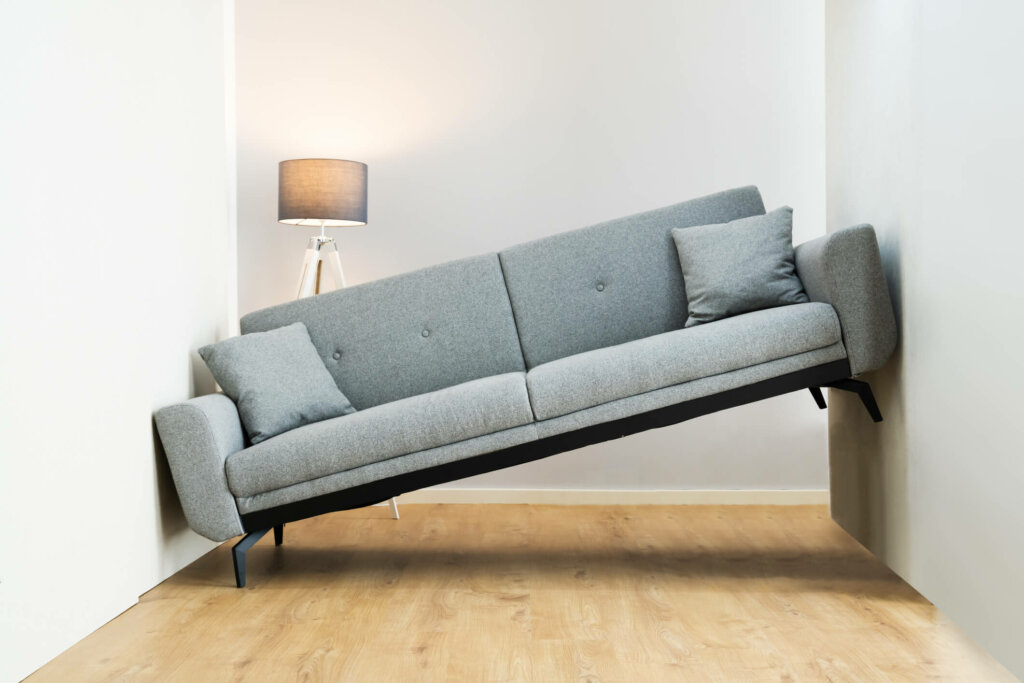 Stuck couch in hallway of empty Hillside house for sale