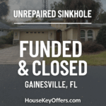 Exterior of a Gainesville, FL home with unrepaired sinkhole activity, labeled “Funded & Closed” by HouseKeyOffers.com.