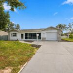 Renovated pool home at 2048 Waterfall Drive in Spring Hill, Florida, following professional sinkhole repairs and a new 2026 roof.