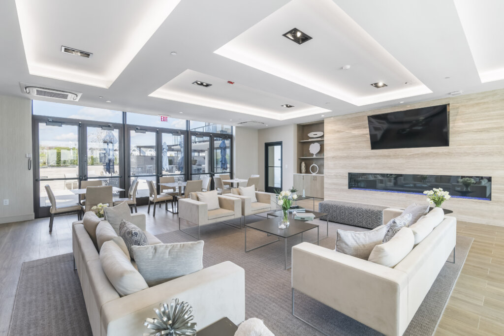 Community lounge with fireplace at South Beach in Long Branch, NJ