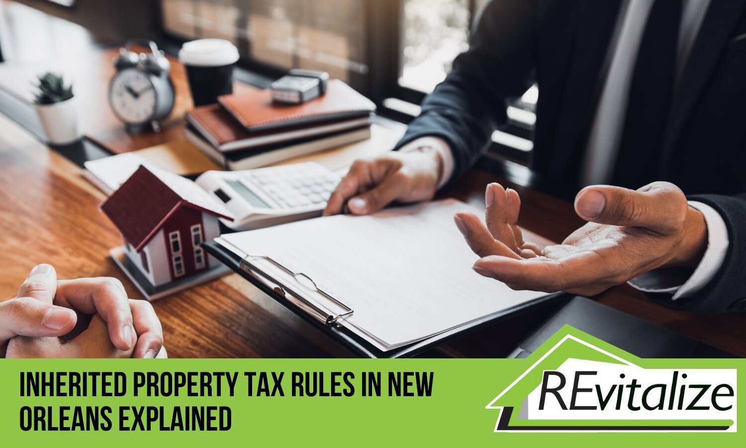 Two professionals discussing property tax rules in New Orleans with a house model and calculator on the desk, symbolizing inherited property solutions.