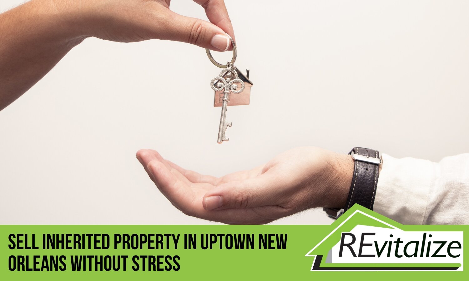 Hands exchanging a house key symbolizing the easy sale of an inherited Uptown New Orleans property with REvitalize Property Solutions.