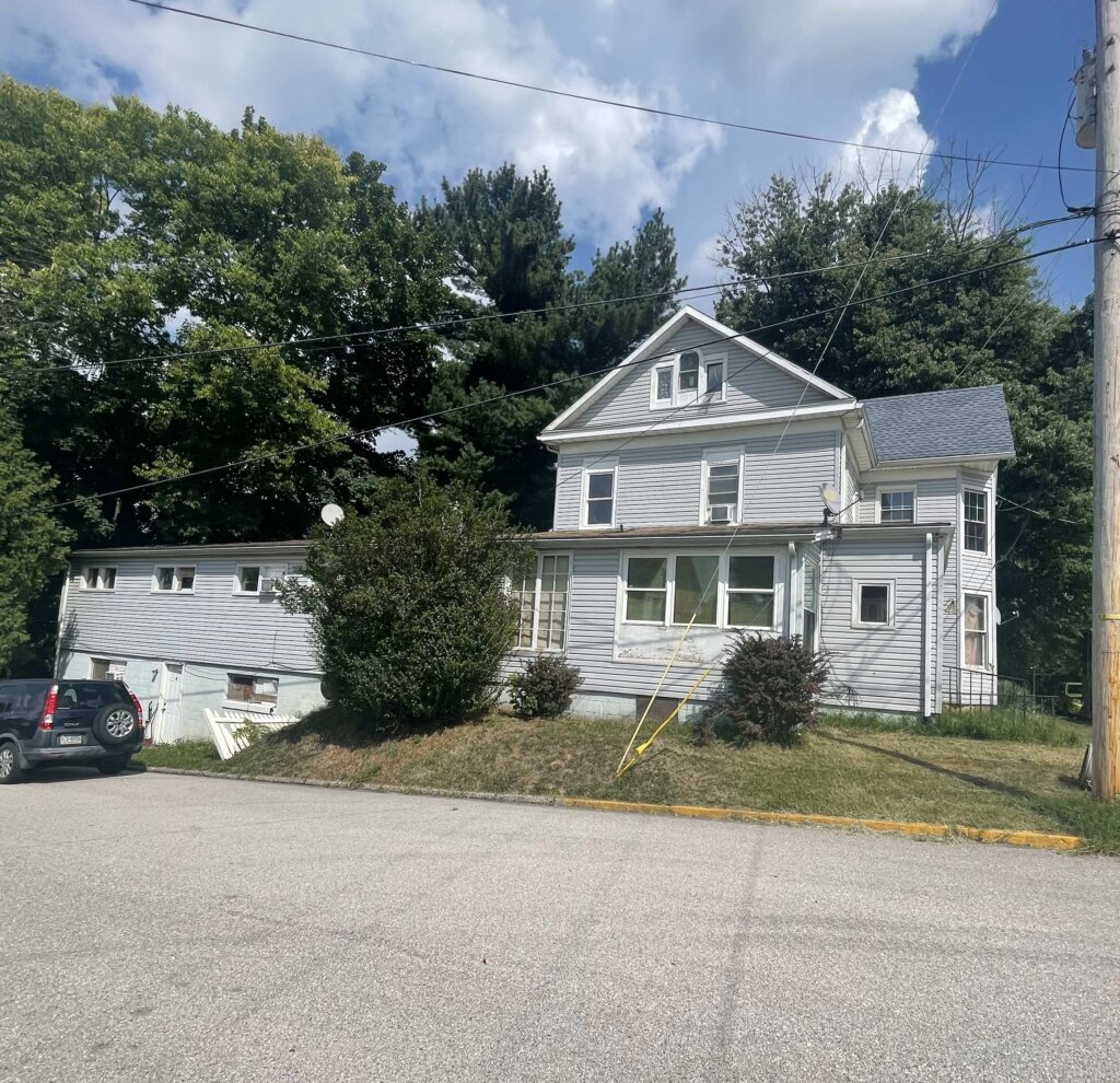 Front of a house we bought fast with cash.