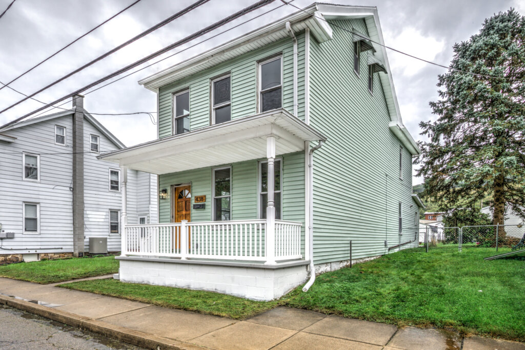 Front of a green home in Delaware County we bought with cash