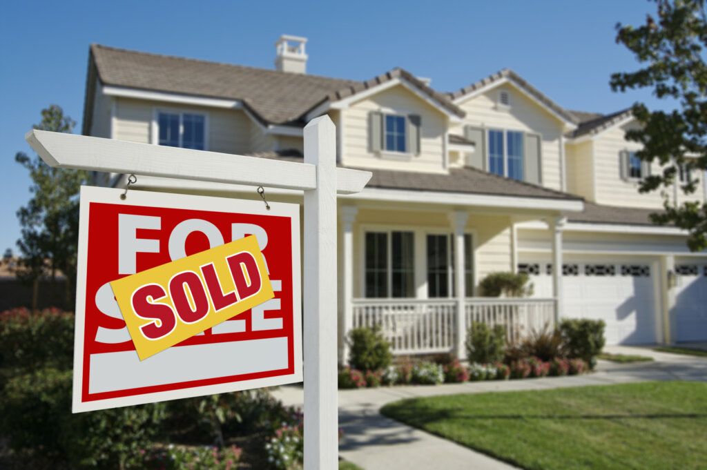 Sold Home Sign in front of house