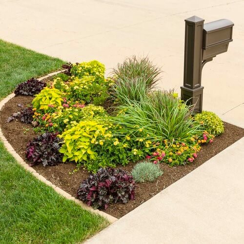 Round flowerbed with ornamental grasses