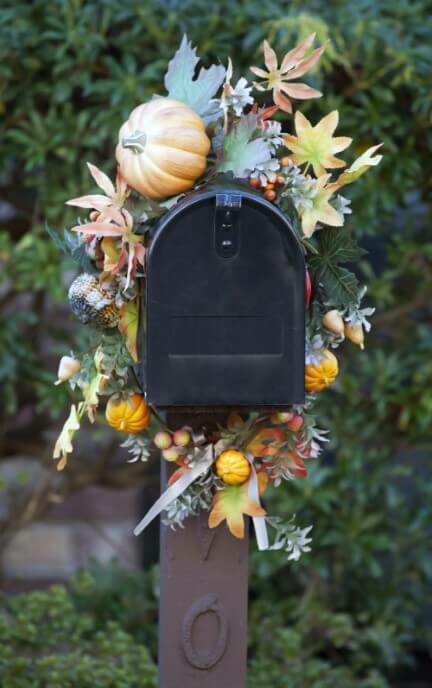 Fall garland wrapped around metal mailbox