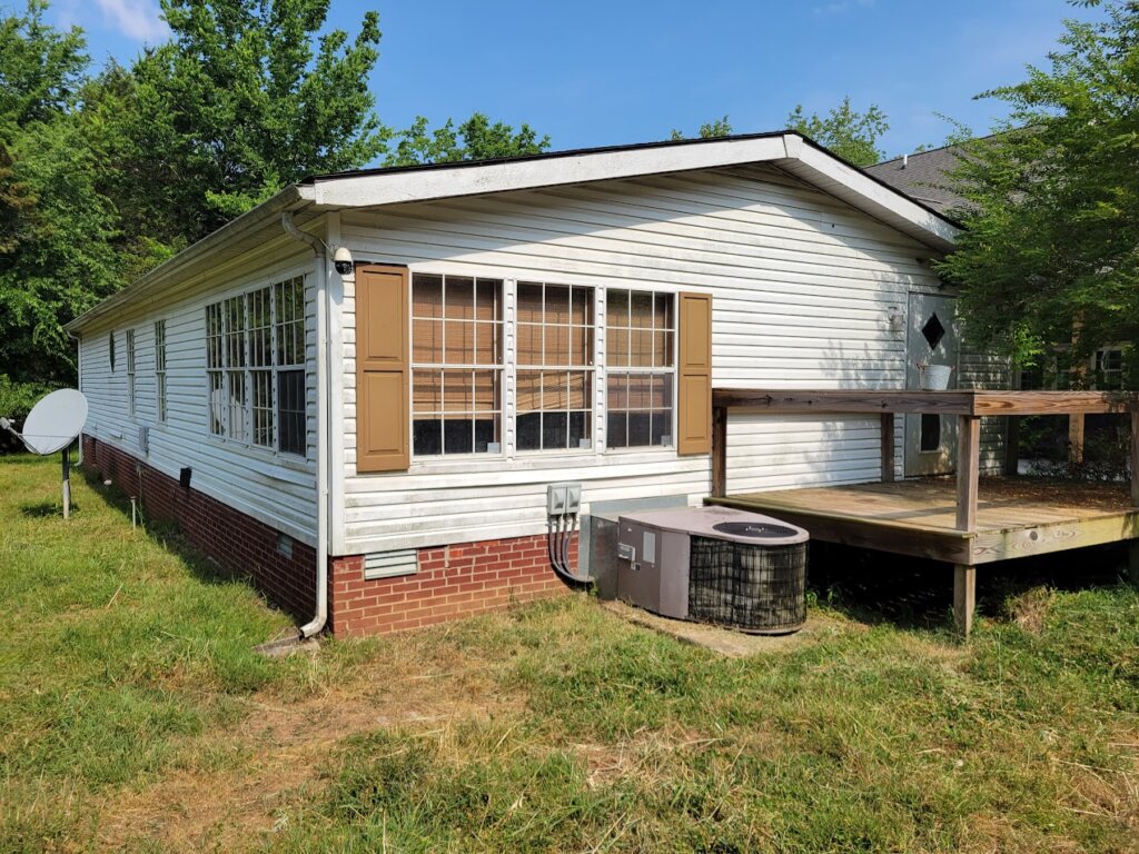 Seller needs space to build a home and sold this Double Wide Mobile Home in Readyville, TN