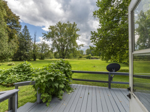 Back deck overlooking Fish Creek at affordable waterfront property near Sylvan Beach NY