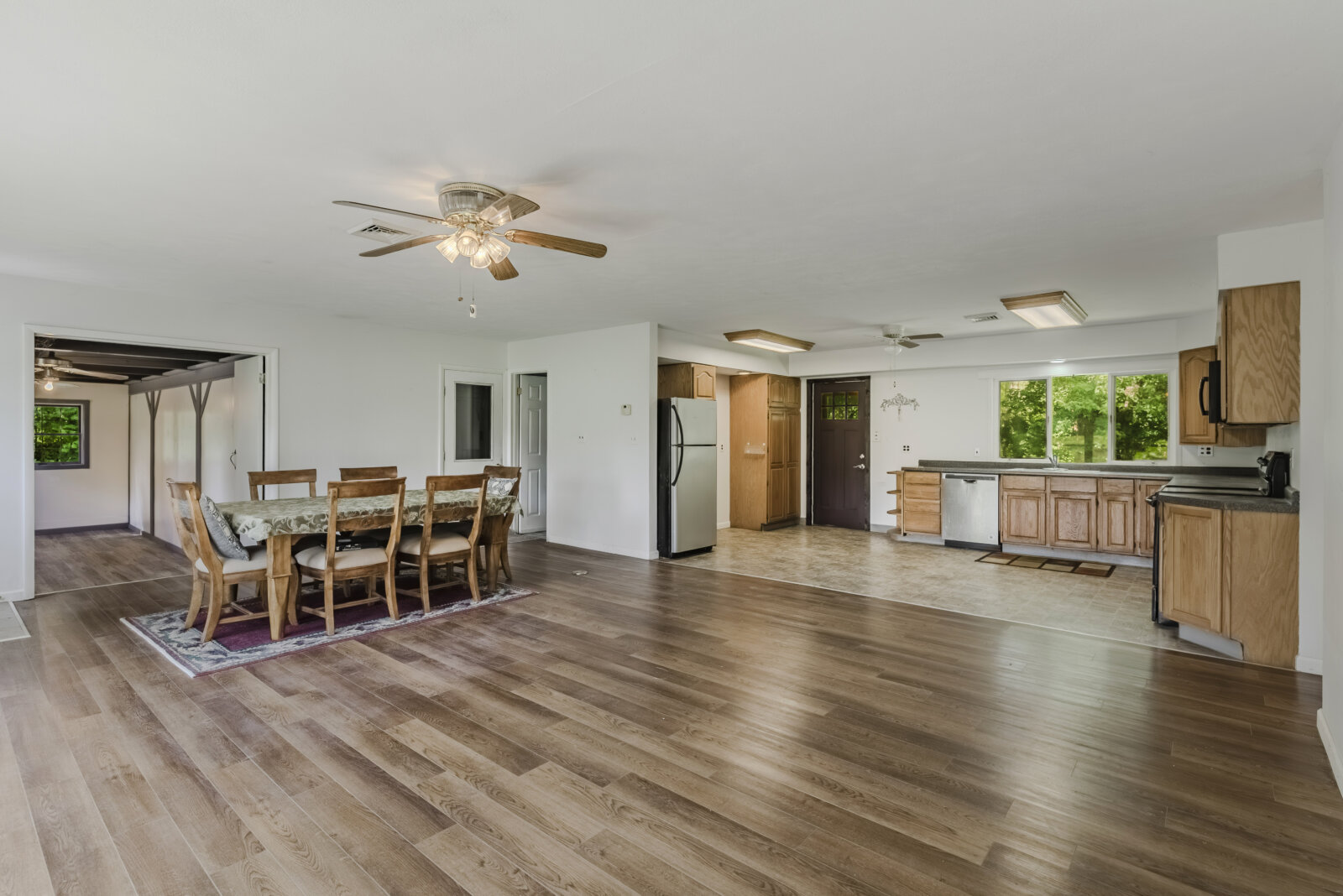 Open-concept kitchen and living area inside affordable waterfront home near Sylvan Beach NY
