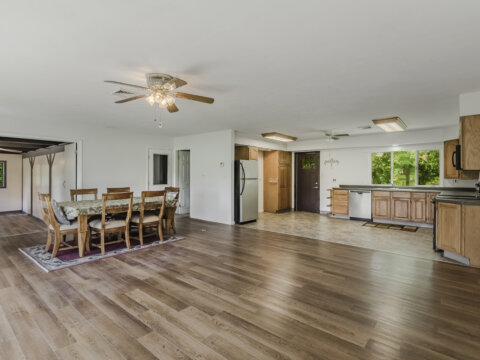 Open-concept kitchen and living area inside affordable waterfront home near Sylvan Beach NY
