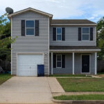 Remodeled exterior of a home that was in pre foreclosure but purchased for cash by Yellowhammer Home Buyers to stop the sellers from going into foreclosure