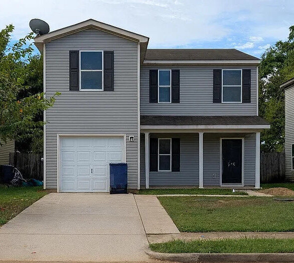 Remodeled exterior of a home that was in pre foreclosure but purchased for cash by Yellowhammer Home Buyers to stop the sellers from going into foreclosure