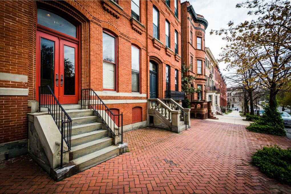 Brick Sidewalk and Row Houses in Bolton Hill, Baltimore, Maryland.