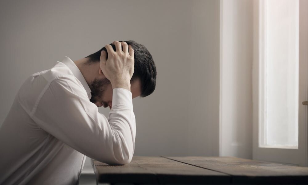 Man in stress laying on the table
