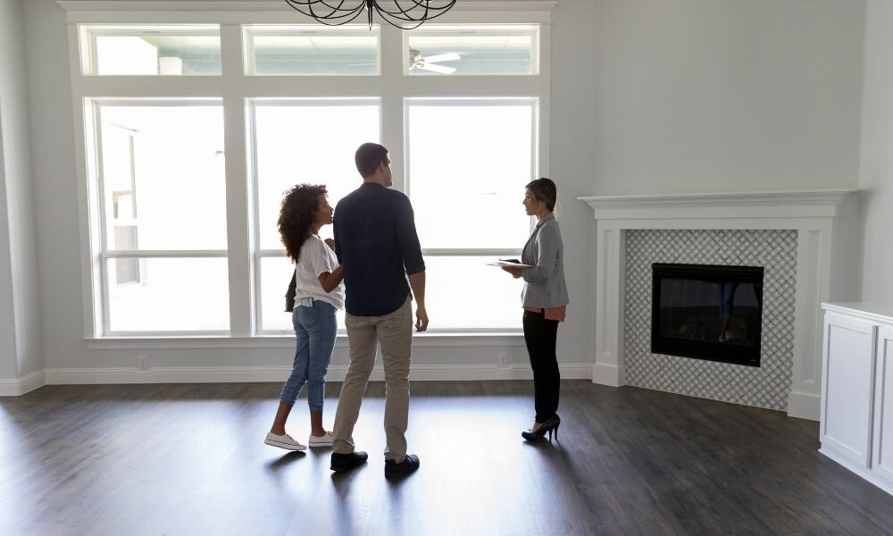 Real estate agent showing house