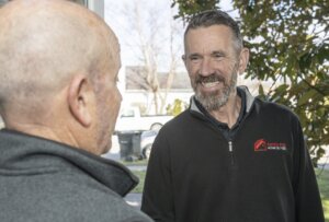 Rapid Fire Home Buyers' employee helping a homeowner sell my house fast.