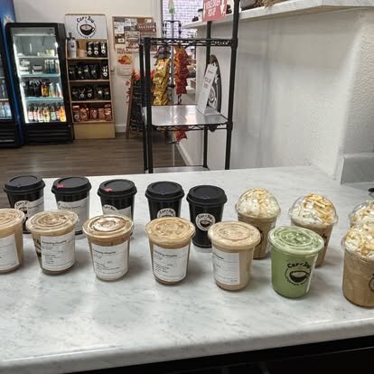 Branded drinks on the counter at Cup of Joy Coffee Shop in Brookfield