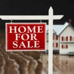 Photo of a for sale sign outside of a house – an illustration for the Lehti Homes Guide to selling your home in Greensboro.