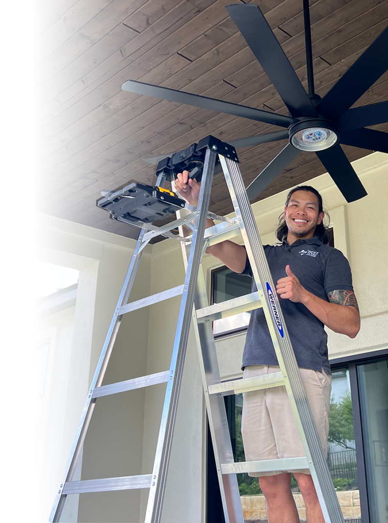 Mark, owner of Best Texas House Buyers, on a ladder making repairs to a house, showcasing the company’s dedication to handling property improvements for sellers in Dallas