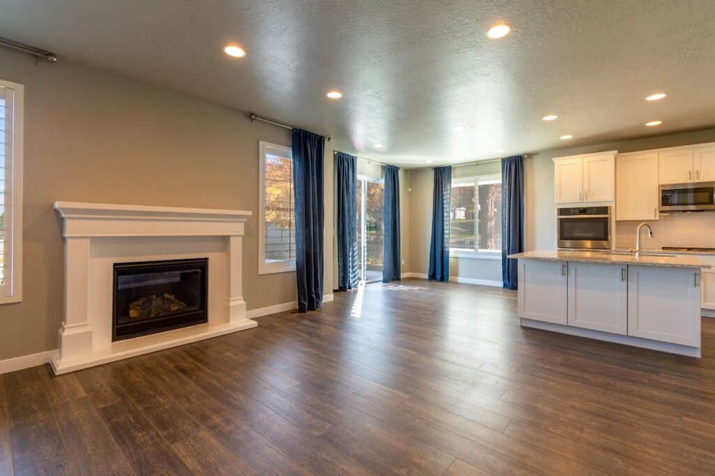 Decluttered home space with a fireplace in the living room when selling your home while moving