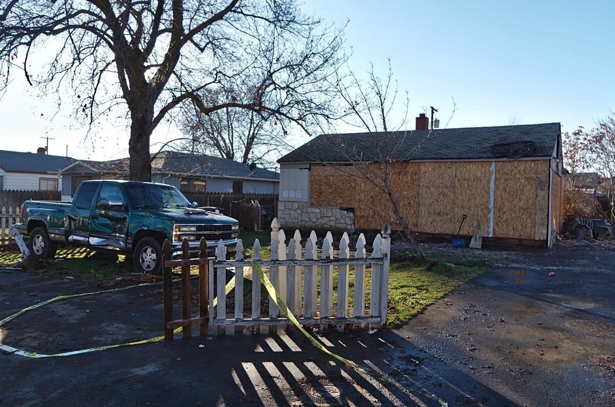 A old inherited home with a parked truck.