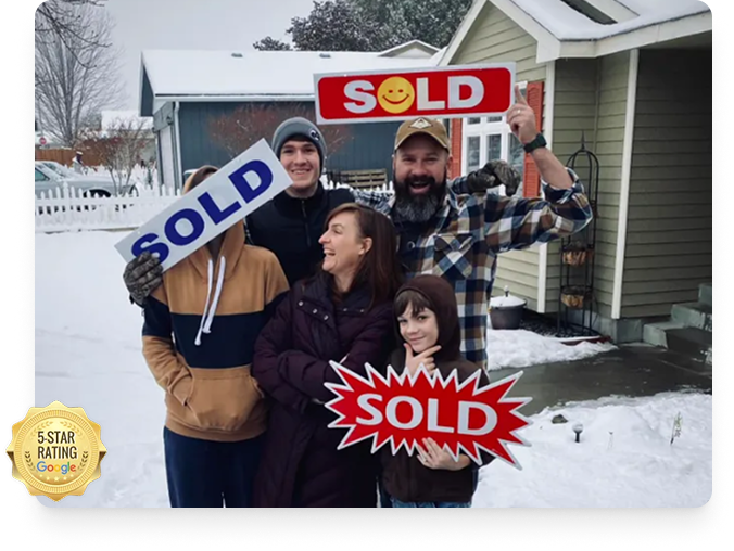 Happy family of homeowners standing outside their snow-covered house holding “Sold” signs after selling their home for cash to Liberty Fair Offer, which helped them find a solution that fit their situation.