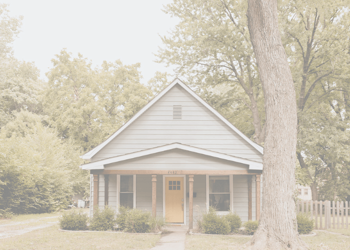 front of house with yellow door