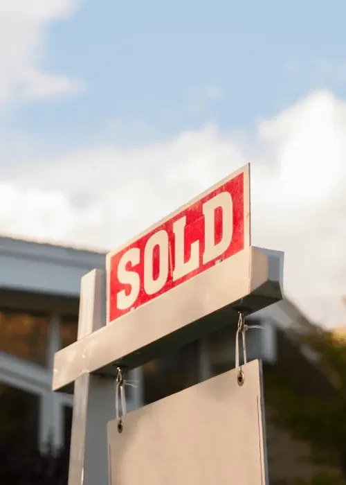 sold sign in front of house
