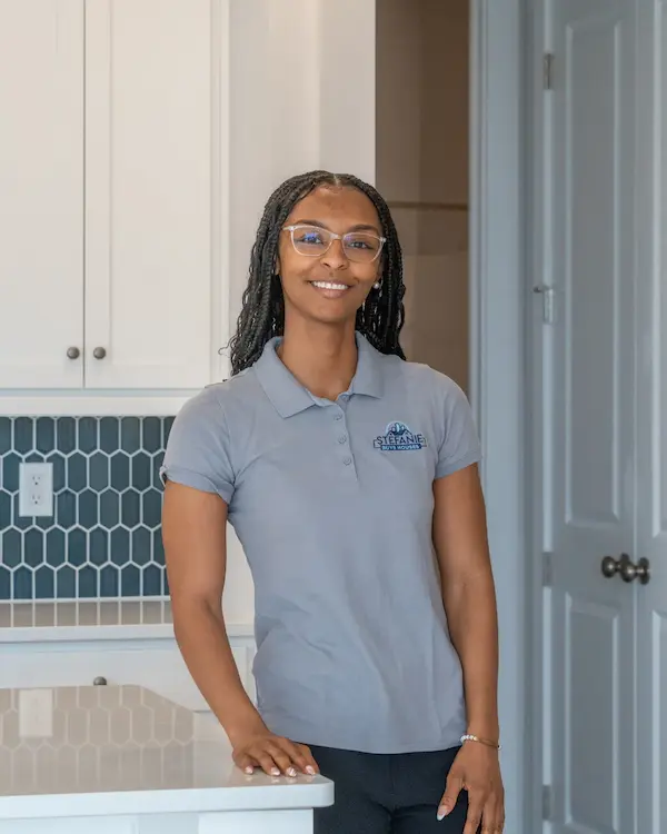 Stefanie Buys Houses team member standing in a kitchen in Harrisburg, PA