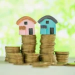House on top of a stack of coins