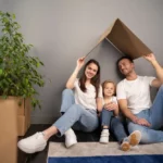 Family under a cardboard roof