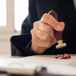 Man stamping on a paper