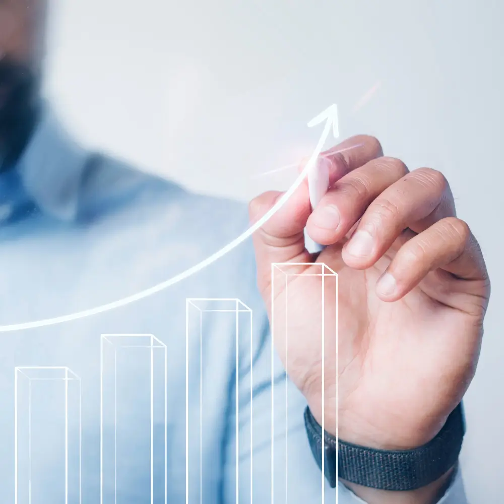 Man drawing an arrow on a chart