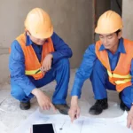 Two construction workers