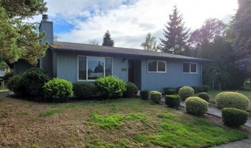 older ranch style house with buyses in front we buy houses oregon and washington state