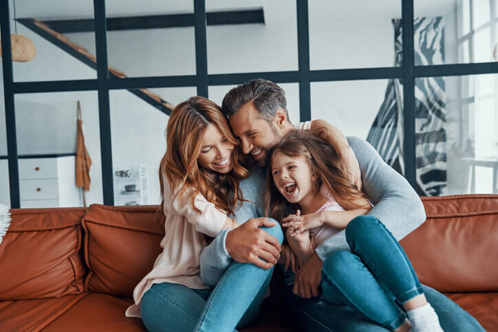 Happy-young-family-playing-moving-out-of-state-oregon-bridgetown-home-buyers