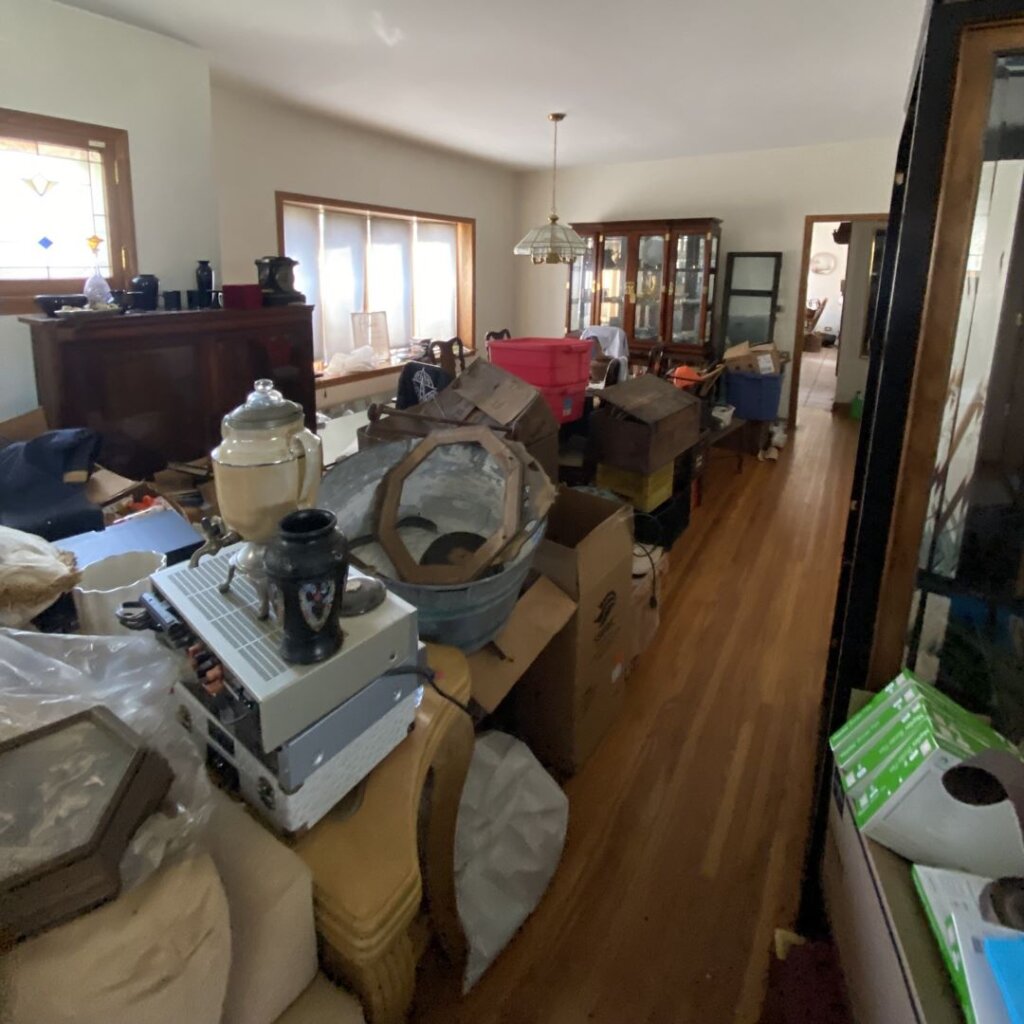 Image shows a room full of clutter that can be overwhelming. Joe Homebuyer of Chicagoland buys houses as-is.