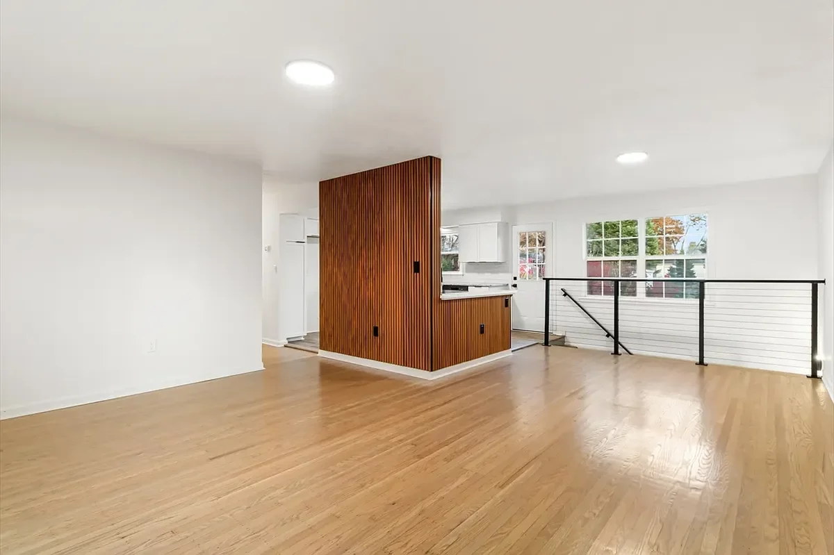 After: Updated living room with wood slat accent wall in Buechel home, Louisville KY