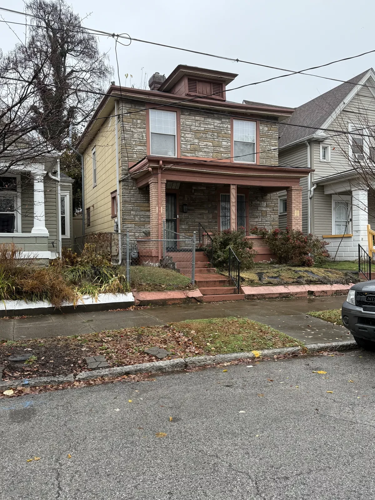 Before: Front exterior of home in Shelby Park, Louisville KY
