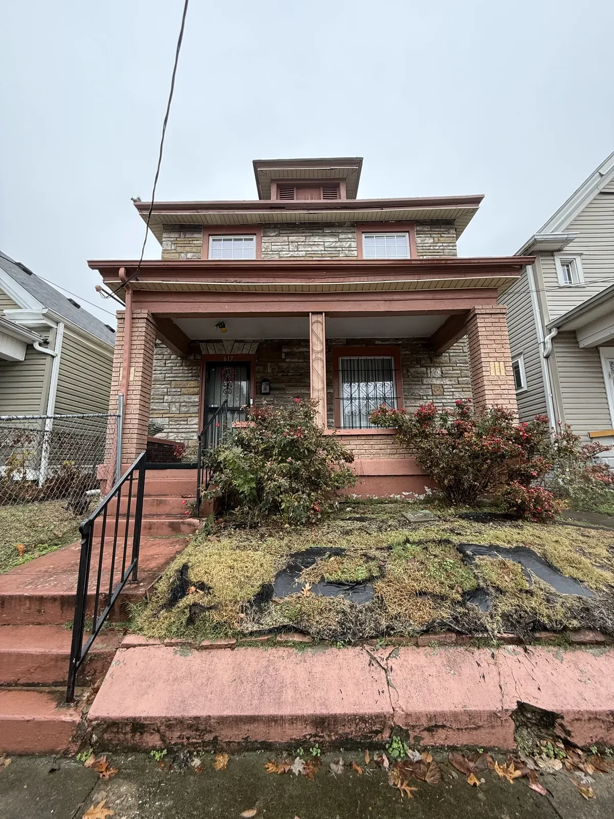 617 Camp Street exterior in Shelby Park Louisville, pre-sale condition showing age and wear on this probate home