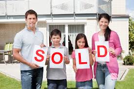 Family With SOLD Sign